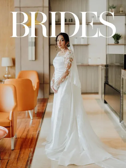 A bridal portrait with an editorial feel. The clean lines of the hotel lobby and the elegance of the bride's gown come together to create a stunning, magazine-style shot.