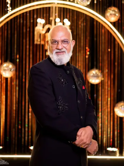 A confident pose in the navy bandhgala with tonal embroidery. This suit is a testament to timeless craftsmanship, perfect for a wedding reception or festive gala.