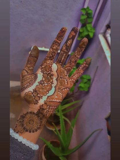 A beautiful fusion design that leaves a flowing trail of negative space through the center. This technique makes the intricate floral and mandala work on either side stand out even more.