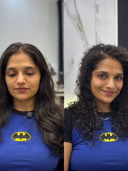 The smile says it all. This is the final result of her modern perm, transforming her straight hair into a head of beautiful, bouncy curls.