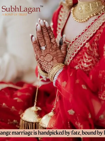 A bride's hands in a prayer position, showing her choora and kalire. We believe an arranged marriage is handpicked by fate and bound by love.