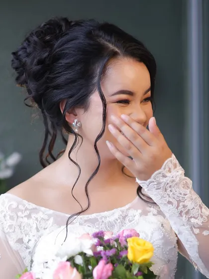 An emotional and candid moment. This image shows that my makeup is not only beautiful but also durable, holding up perfectly through all the happy tears and emotions of the day.