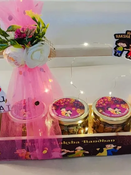 For Raksha Bandhan, I love creating hampers that feel both personal and festive. This wooden basket hamper is a popular choice, lit with delicate fairy lights and filled with jars of cookies and healthy muesli. It’s a complete Rakhi gift set, showing how I combine traditional sentiments with modern aesthetics.