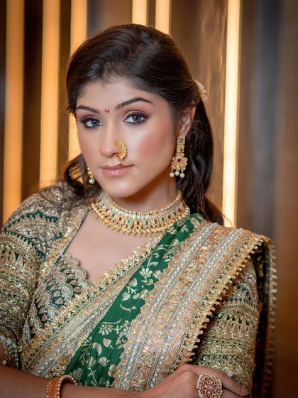 A powerful, regal pose. The makeup is flawless, with defined eyes that command attention and skin that looks like silk.
