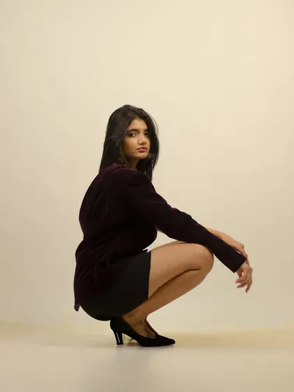 A low-angle shot adding a different perspective to the fashion series, emphasizing the power of the pose.