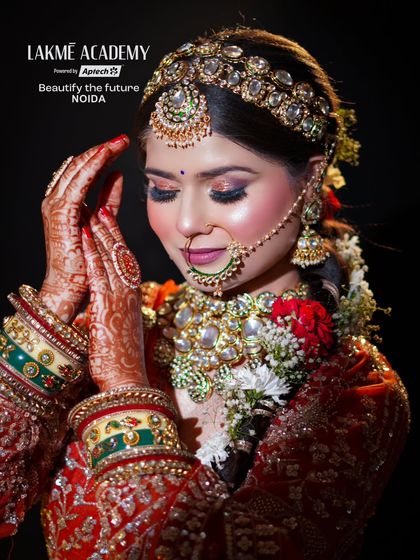 The hands of a bride are just as important as her face. This image highlights the beautiful henna and jewelry, details we emphasize in our comprehensive bridal styling training.