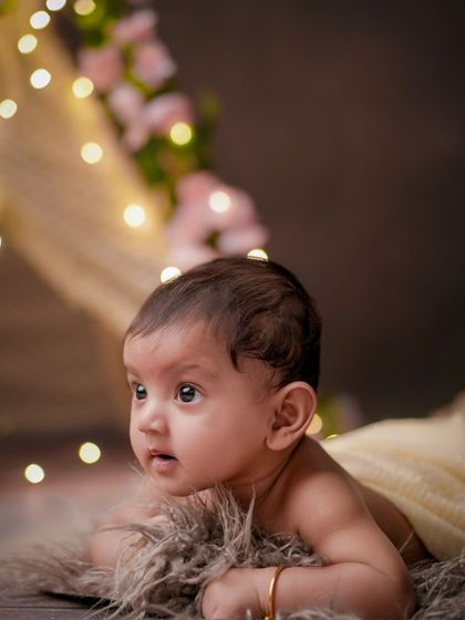 A world of wonder. This older baby is captivated by the lights and colors of the studio, and I love capturing that sense of awe.