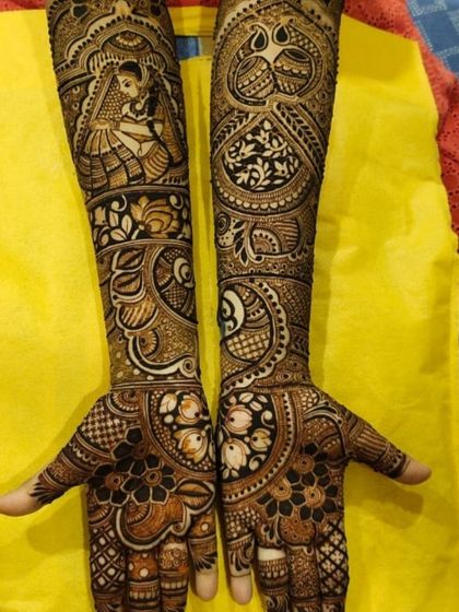 A beautiful bridal design combining a traditional bride portrait with paisleys and floral work. The use of negative space makes the central figure stand out.