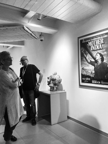 A quiet moment of discussion during a tour of the Museum of Art and Photography (MAP). The galleries are designed to encourage personal reflection and dialogue about the art on display.