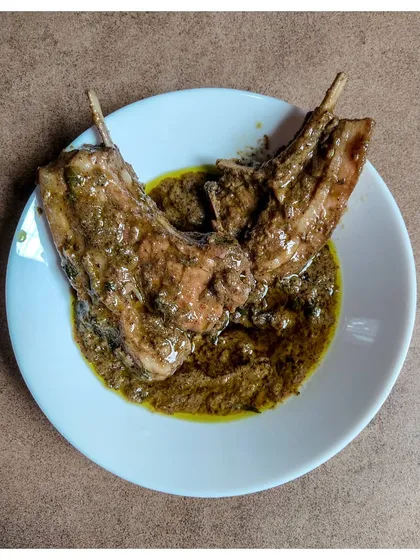 A close-up of my Pork Chops Pepper Masala, showcasing the thick, peppery gravy clinging to the tender chops.