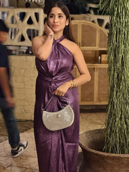 A solo shot of my purple metallic dress. I love the texture and the way it catches the light. It's the perfect statement dress for a night out.