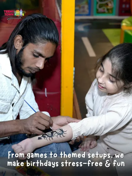 A close-up of our tattoo artist at work. We offer a variety of designs, from cool tribal patterns to cute characters.
