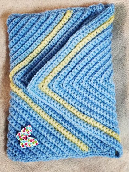 An envelope of love. This blue and yellow striped clutch was custom-made for a teenager. It's a chic and handmade accessory for carrying essentials.