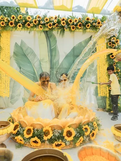 A Haldi ceremony is all about joy and vibrant moments. We love creating fun, interactive setups like this one, complete with traditional elements and plenty of room for playful splashing, ensuring your photos are as lively as the celebration itself.