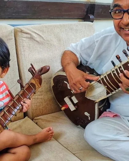 The love for music runs deep in my family. Here is my Baba, my first Guru, sharing a moment with my nephew and his own small sitar. This image perfectly captures my belief that music education is a gift to be passed down through generations, starting from a young age.