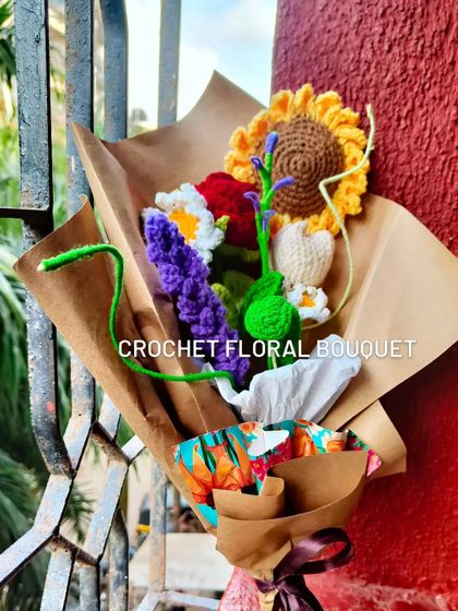 A close up of the custom floral bouquet. You can see the sunflower, rose, daisy, lavender, and tulip all nestled together.