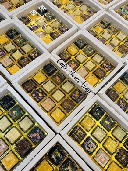 A sea of my assorted chocolate boxes, all packed and ready for Diwali delivery. I take great care in preparing large orders to ensure quality and consistency.
