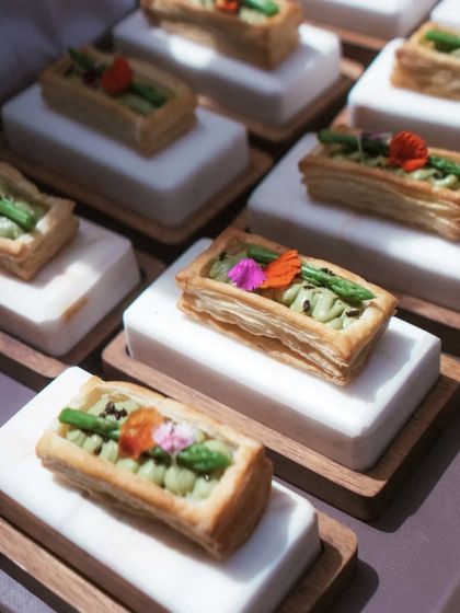 The first course sets the tone for the meal. This Asparagus Vol-au-vent features a light puff pastry filled with an asparagus and mint mousse, garnished with edible flowers.
