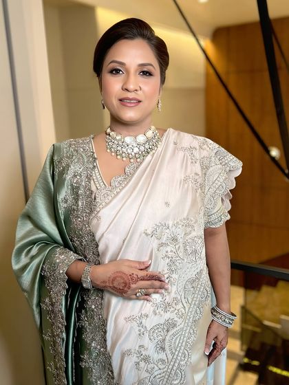 A portrait of the mother, her makeup looking fresh, simple, and just right for the occasion.