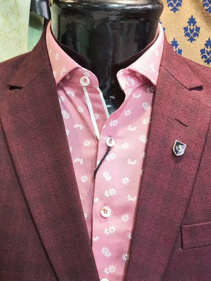 A collection of our designer suits, showcasing a variety of colors, fabrics, and custom details like embroidery, unique lapels, and accessories. Each piece is crafted to make a lasting impression.