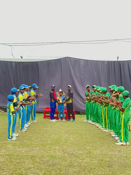 The team celebrates as they receive the winner's trophy.