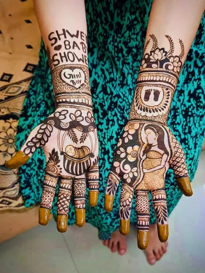 The same design with the henna paste still on, showing the precision of the application before the stain develops.