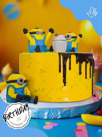 Bello! This fun Minions cake is causing some happy mischief. The bright yellow design features playful Minions and a chocolate drip, perfect for a fan of the hilarious characters.