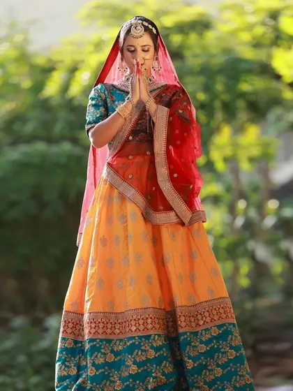 A moment of quiet reflection during our outdoor ethnic wear shoot. The 'namaste' pose, combined with the traditional attire and jewellery, creates a look of pure elegance.