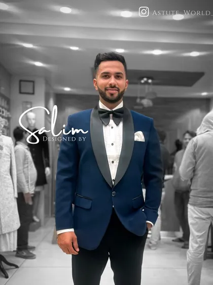 Beyond the embellishments, the foundation is always a flawless fit. This classic navy blue tuxedo with a satin shawl lapel showcases my commitment to sharp, timeless tailoring for any formal occasion.
