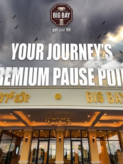 Your journey's premium pause point. A dramatic shot of our main entrance under a cloudy sky, emphasizing the high-quality break we offer.