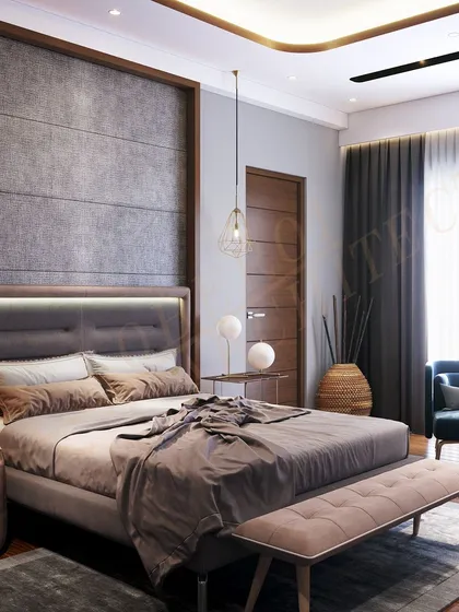 The room's design focuses on creating a calm environment, with a plush bed, a comfortable seating area, and soft, indirect lighting.
