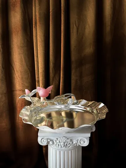 A tray this regal deserves a setting to match. My rose quartz bird tray, with its whimsical bird and floral accents, brings a touch of royalty and nature-inspired beauty to your serveware.