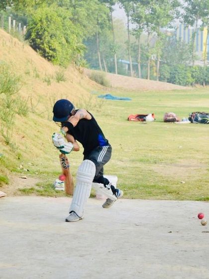 A powerful shot captured in action. This image shows the perfect extension of the arms and body rotation, key components of a strong hit.