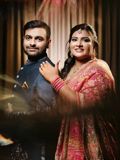 A creative and romantic portrait of the newly married couple, glowing with happiness.