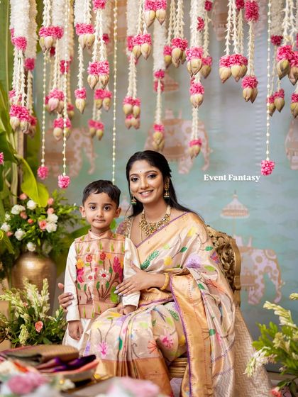 The bride shares a special moment with her son during the pre-wedding rituals. It's a blessing to create spaces where families can come together and make new memories.