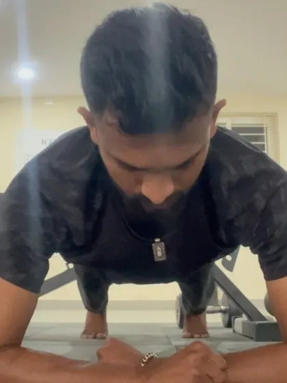A moment of focus before beginning a set of pushups. The mental preparation is just as important as the physical execution.