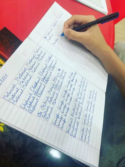 Mastering word formation is a key step in our handwriting course. This student is practicing writing words repeatedly, which helps build muscle memory for consistent and beautiful cursive script.