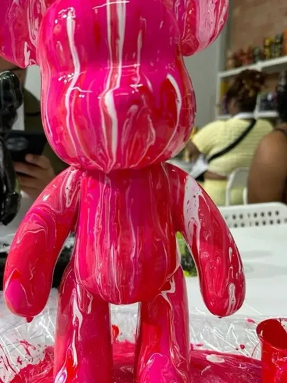 A close-up of this vibrant pink and white creation, still glistening with wet paint. The pouring technique creates these incredible streaks and patterns, making every single bear a unique piece of DIY decor.