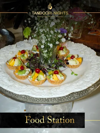As the sun goes down, the flavors take over. Our multi-cuisine food stations, like this one featuring fruit tartlets, add charm and elegance to any event.