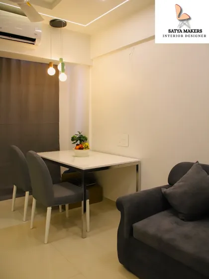 A minimalist dining area for two, demonstrating how even small spaces can be designed for comfort and style.
