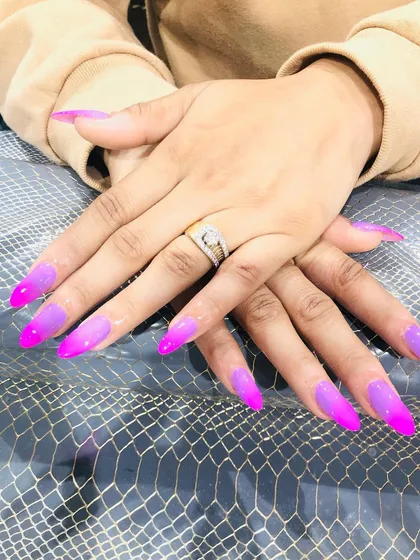 A vibrant ombre set fading from a soft lavender to a bright neon pink.
