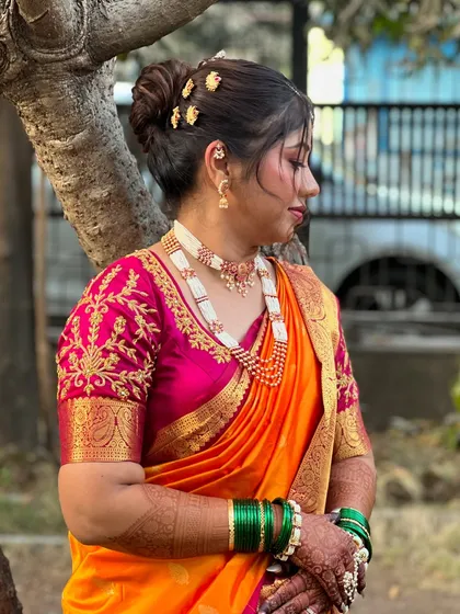 Another angle of this beautiful nauvari look, showing the rich texture of the saree and the detailed blouse embroidery.