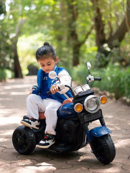 A focused moment on his bike. This shot highlights the cool details of the biker theme, from his jacket to the miniature motorcycle.