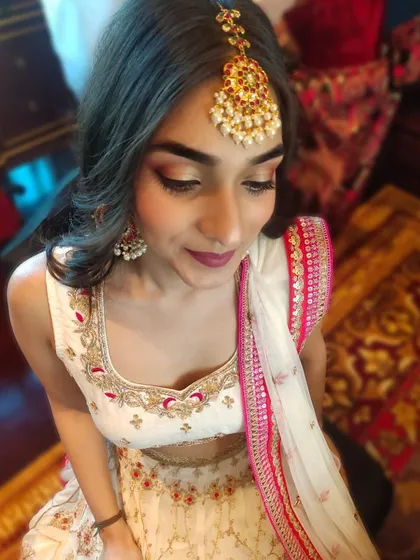 A closer look at the wedding guest's makeup, highlighting the blended eyeshadow and flawless skin. This look is perfect for guests who want to look glamorous yet elegant.