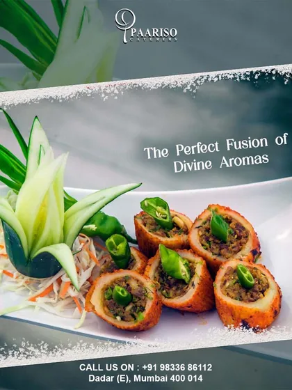 This dish showcases a perfect fusion of divine aromas. These stuffed and fried rolls are garnished with fresh chili and served with an artfully carved vegetable garnish.