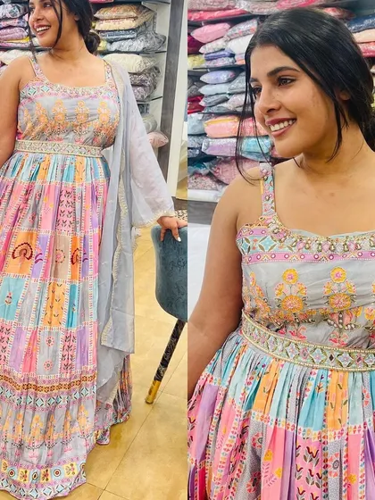 This multi-color gown with pastel shades is a dreamy and romantic choice. The embroidered belt and yoke add a touch of sparkle to the flowing silhouette.