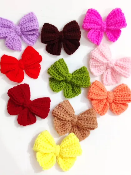 Coquette bow keychains available in a whole spectrum of colors, from bold reds and pinks to earthy tones.