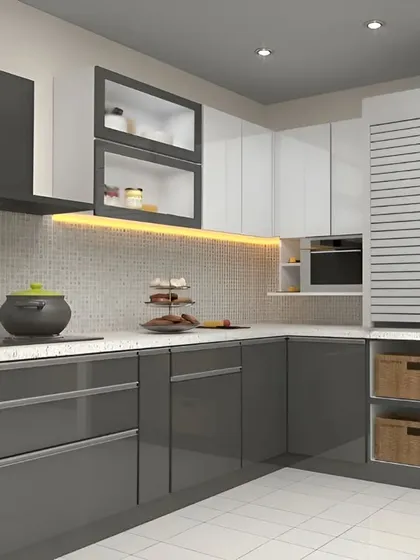 A modern L-shaped kitchen in a chic grey and white palette. This design features glossy grey lower cabinets, white upper cabinets with frosted glass, and a ventilated pantry unit for practical, stylish storage.