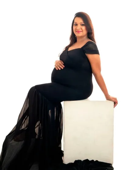 A classic seated portrait in our black mermaid gown with a sheer train.
