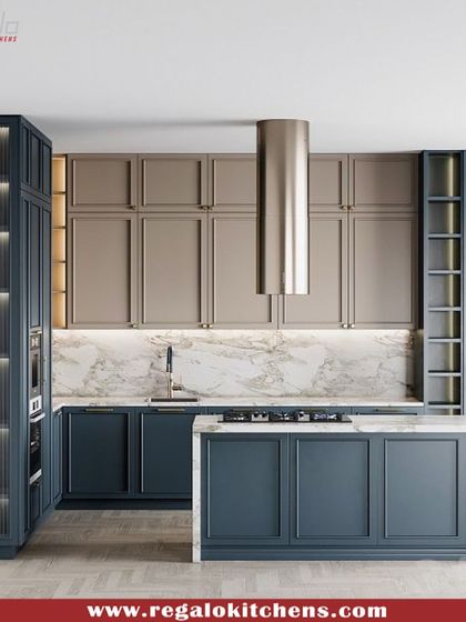 A classic design with a modern twist. This island kitchen features two-tone cabinetry in navy blue and beige, with traditional paneling and a marble backsplash. The island offers additional prep space and storage, perfect for a busy family kitchen.
